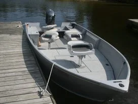 Boat tied off to Dock
